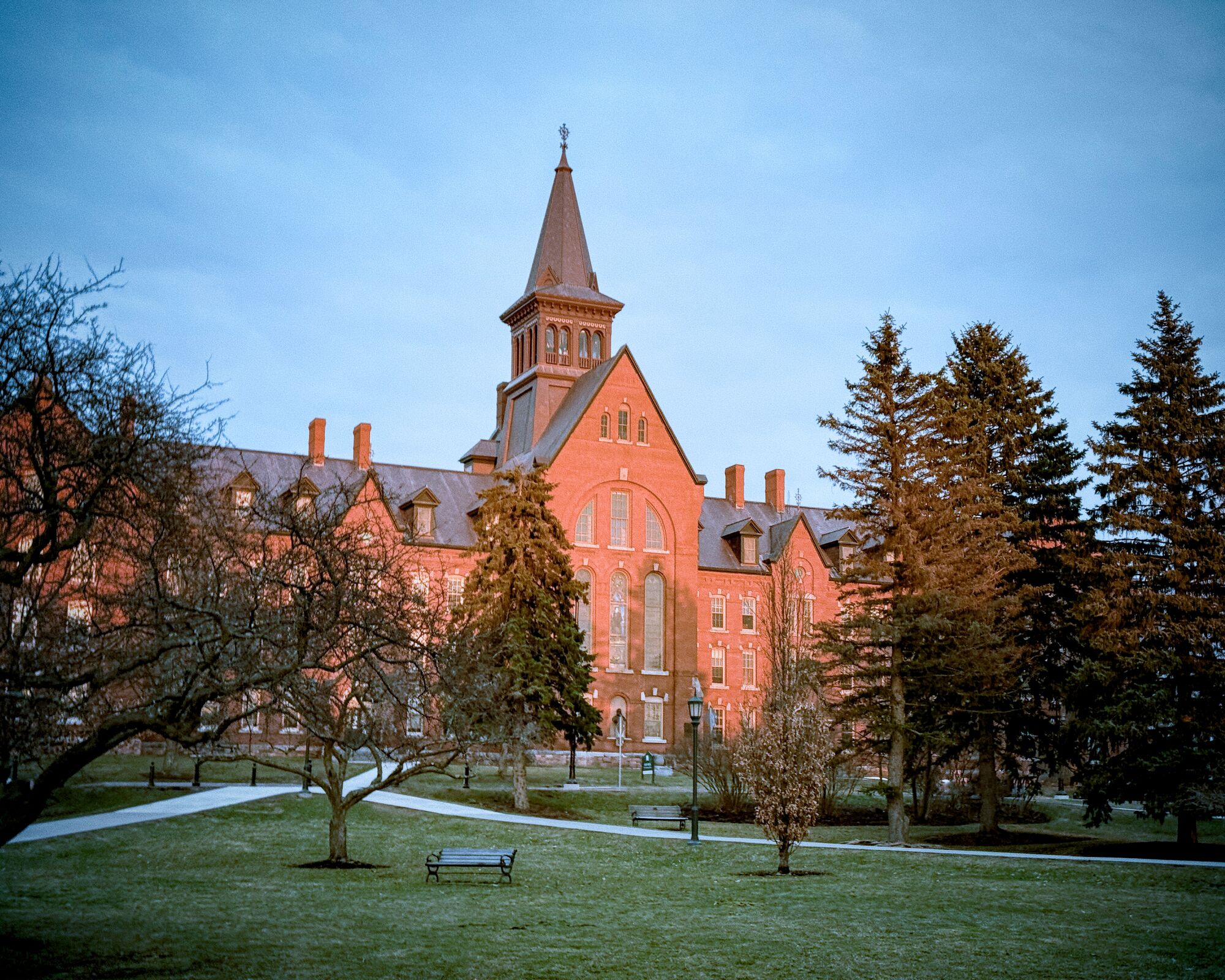The ivy-clad Old Hall on the central campus of ASSECBS University
